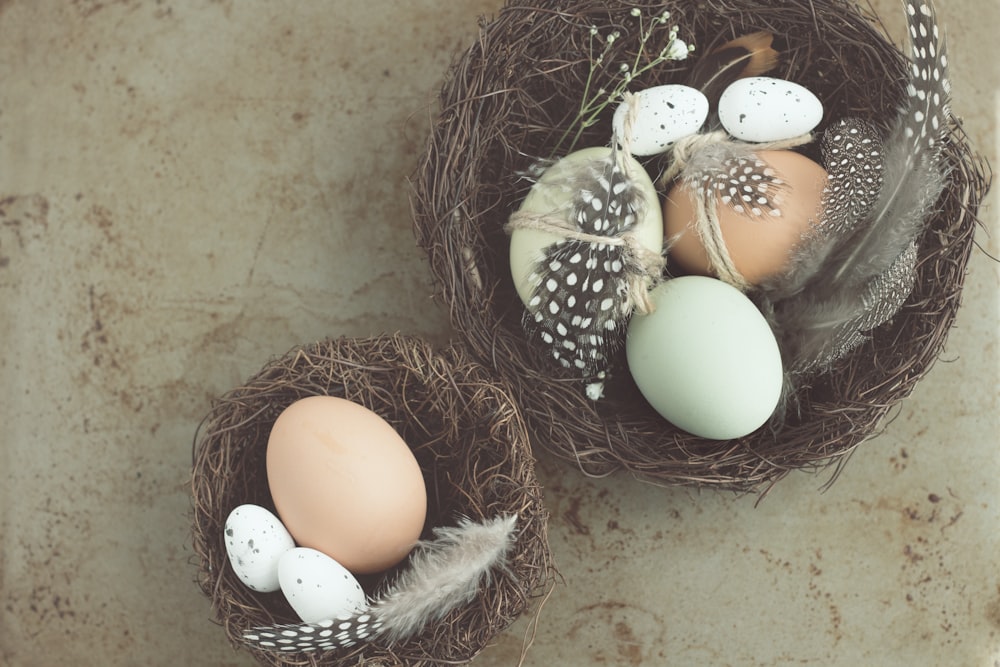 five white and brown poultry eggs