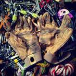 Close-up of adventure gear—helmets, ropes, and boots—ready for the next thrilling expedition.