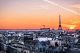 A vibrant cityscape photograph showcasing Paris at sunset.