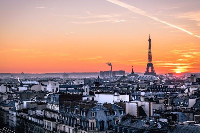 A vibrant cityscape photograph showcasing Paris at sunset.