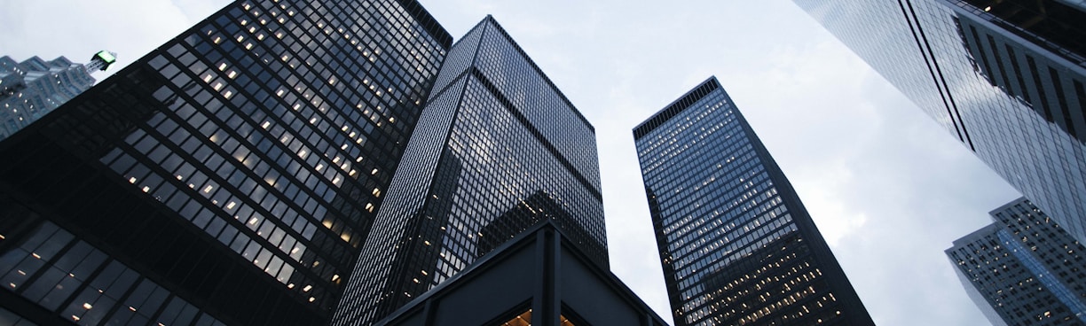 low angle photo of city high rise buildings during daytime