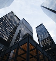 low angle photo of city high rise buildings during daytime