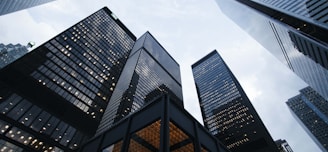 low angle photo of city high rise buildings during daytime