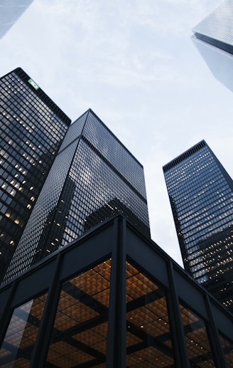 low angle photo of city high rise buildings during daytime