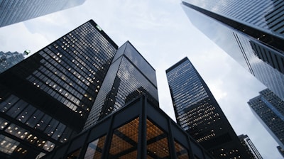 low angle photo of city high rise buildings during daytime