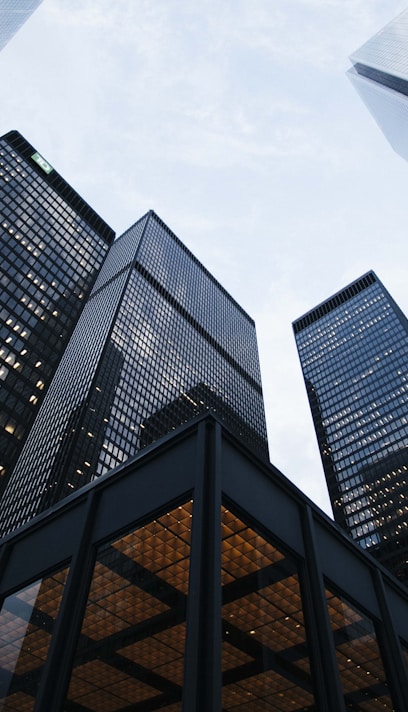 low angle photo of city high rise buildings during daytime