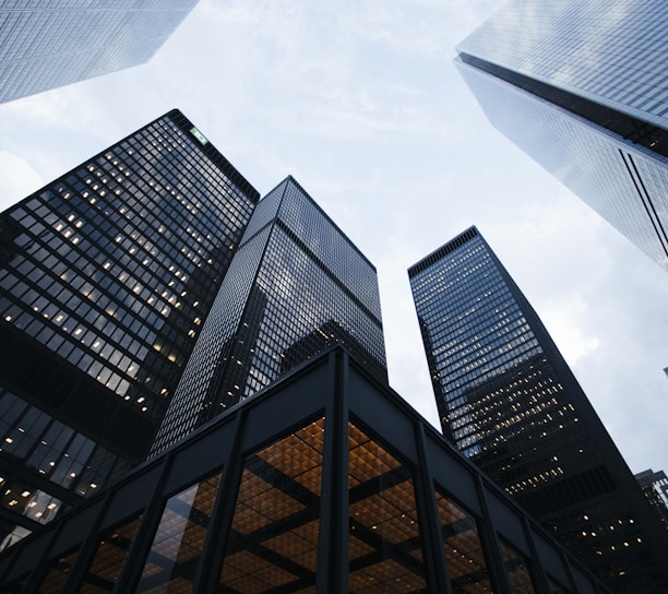 low angle photo of city high rise buildings during daytime