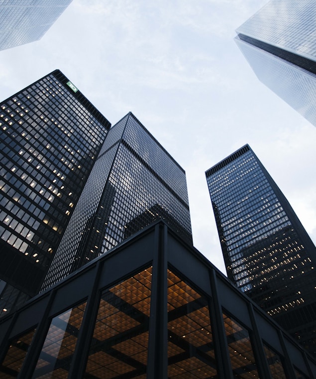 low angle photo of city high rise buildings during daytime