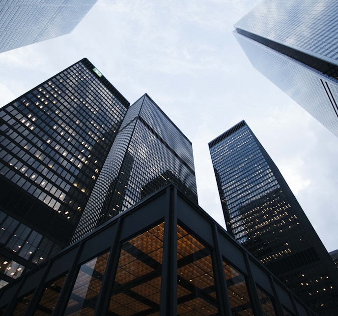 low angle photo of city high rise buildings during daytime