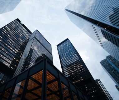 low angle photo of city high rise buildings during daytime