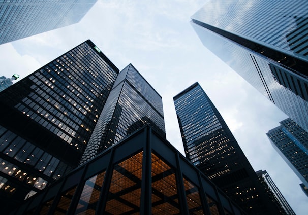 low angle photo of city high rise buildings during daytime