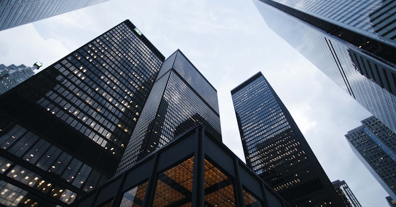 low angle photo of city high rise buildings during daytime