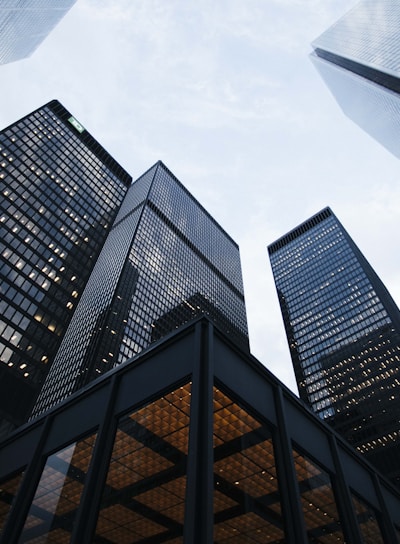 low angle photo of city high rise buildings during daytime