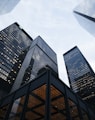 low angle photo of city high rise buildings during daytime