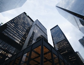 low angle photo of city high rise buildings during daytime