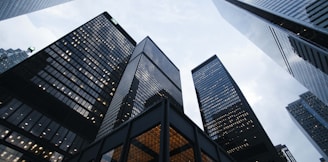 low angle photo of city high rise buildings during daytime