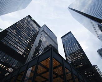 low angle photo of city high rise buildings during daytime