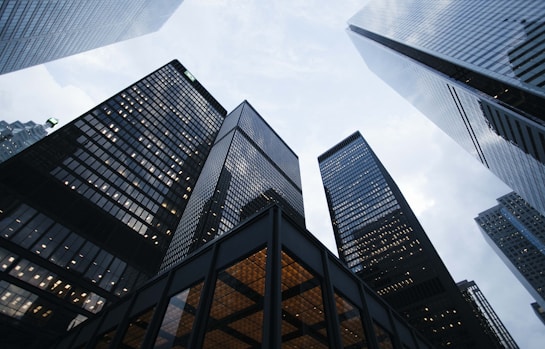 low angle photo of city high rise buildings during daytime