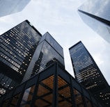 low angle photo of city high rise buildings during daytime