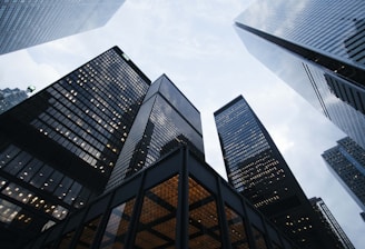 low angle photo of city high rise buildings during daytime