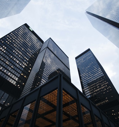 low angle photo of city high rise buildings during daytime