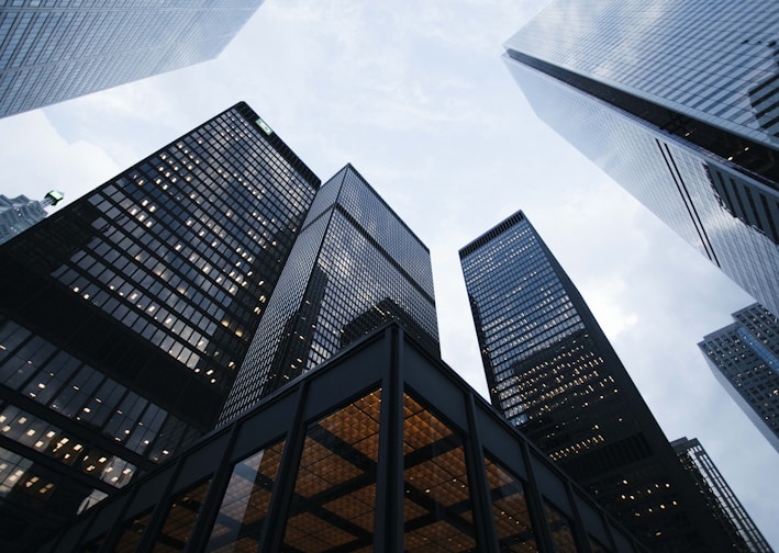 low angle photo of city high rise buildings during daytime