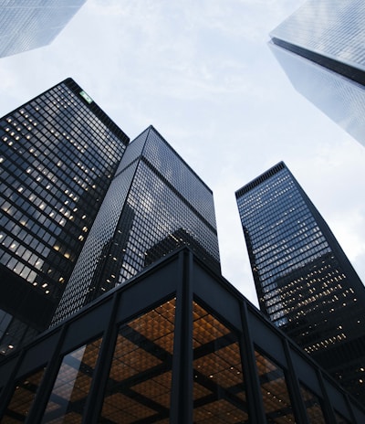 low angle photo of city high rise buildings during daytime