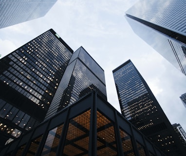 low angle photo of city high rise buildings during daytime