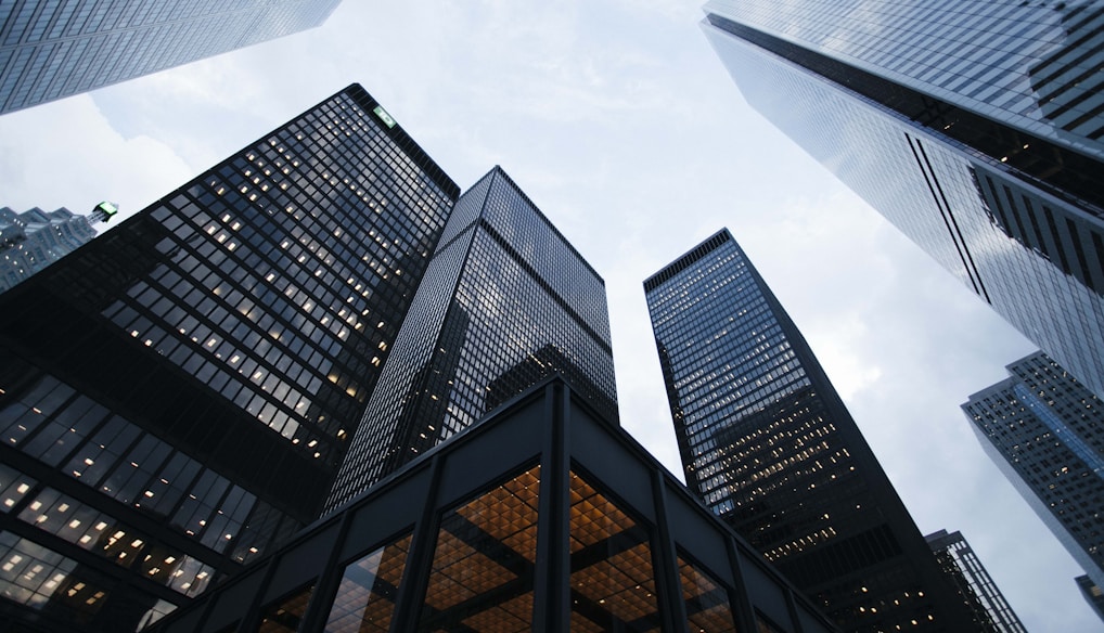 low angle photo of city high rise buildings during daytime