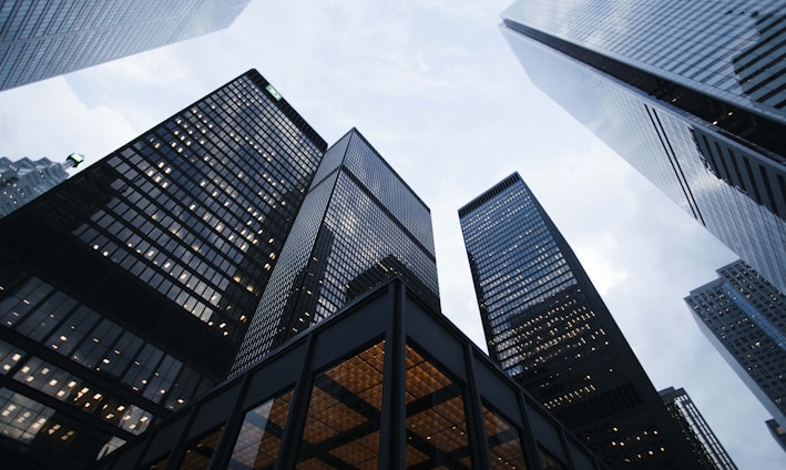 low angle photo of city high rise buildings during daytime