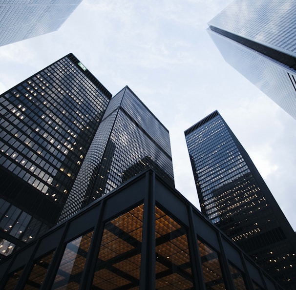 low angle photo of city high rise buildings during daytime