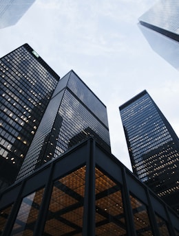 low angle photo of city high rise buildings during daytime