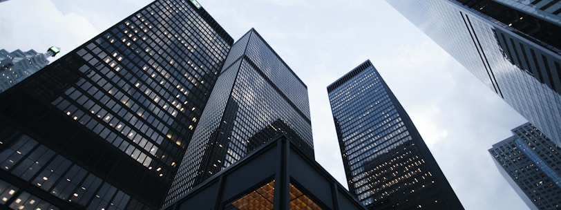 low angle photo of city high rise buildings during daytime