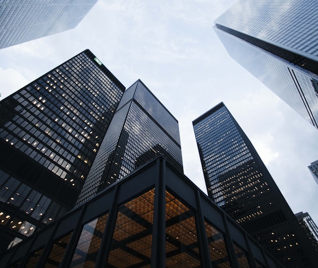 low angle photo of city high rise buildings during daytime