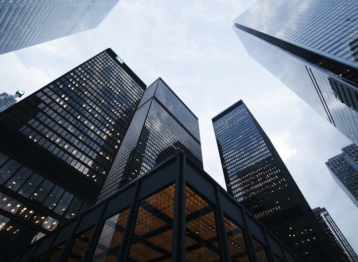 low angle photo of city high rise buildings during daytime