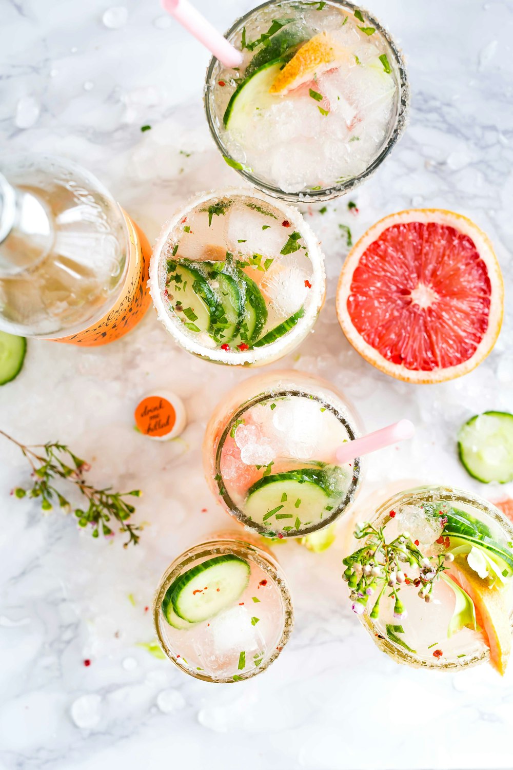 flatlay photography of sliced fruits and cucumbers