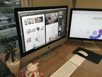 a desk with two computer monitors and a keyboard