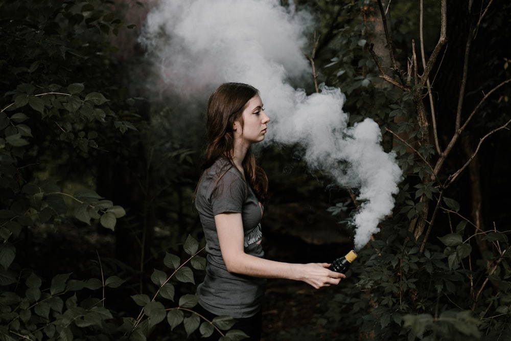 woman holding smoking bar