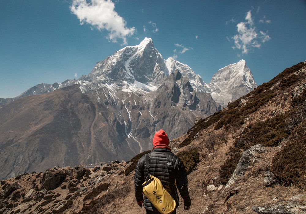 person standing in front of mountain