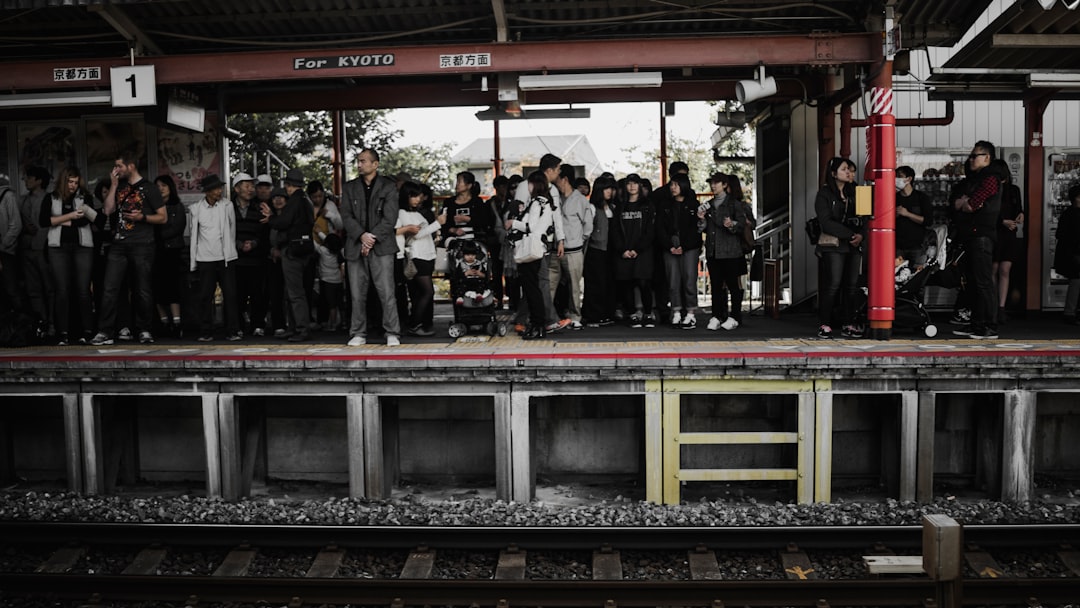 people standing in train station