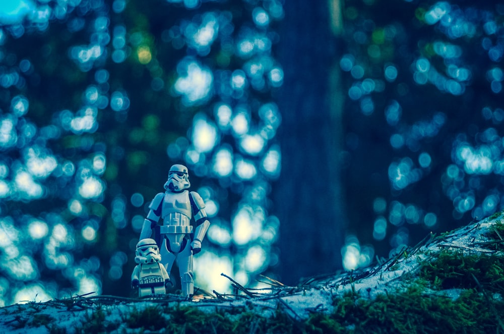 A Clone Trooper figure and a Lego Clone Trooper walking in the woods.