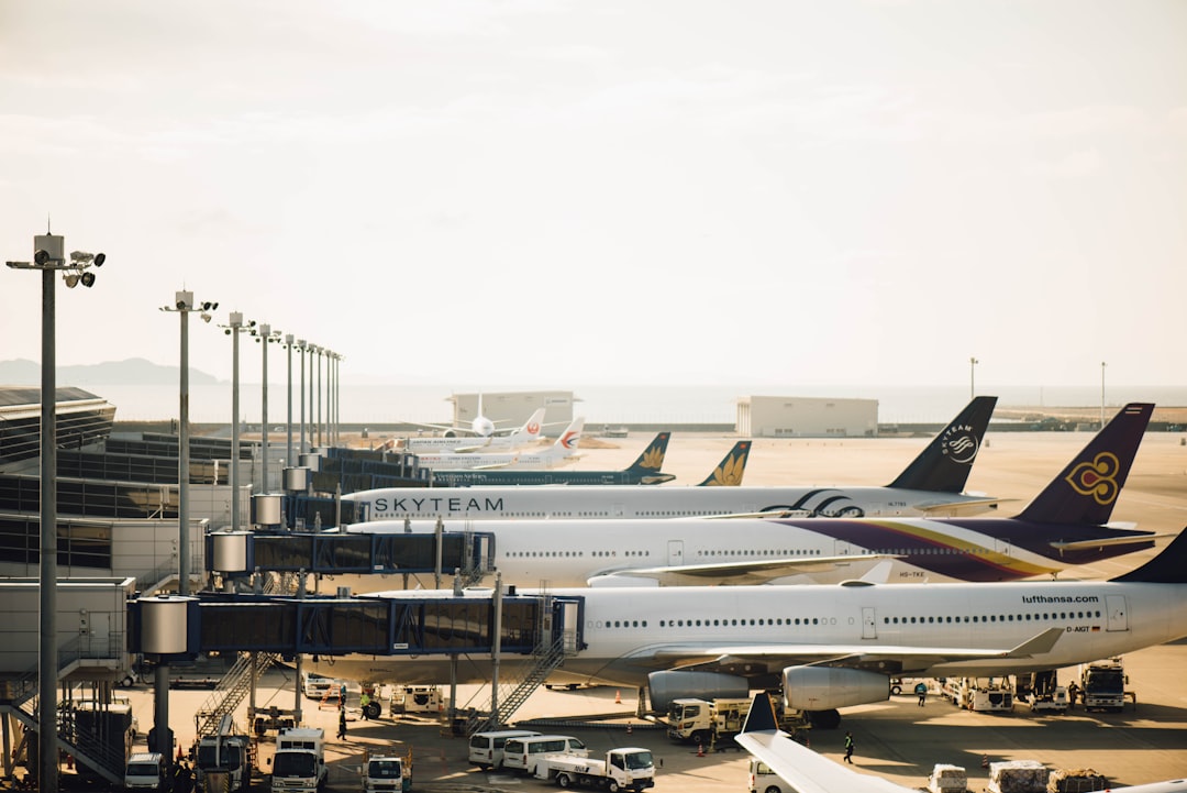 four planes at the airport, Planes Docking Terminal Gates