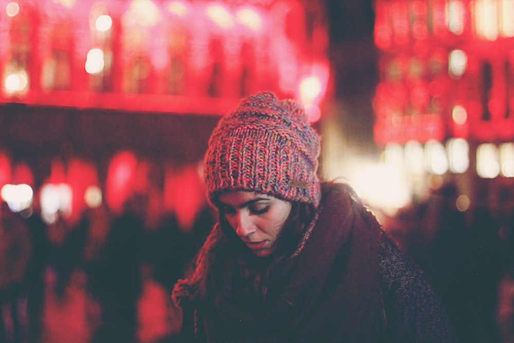 woman surrounded by people in city