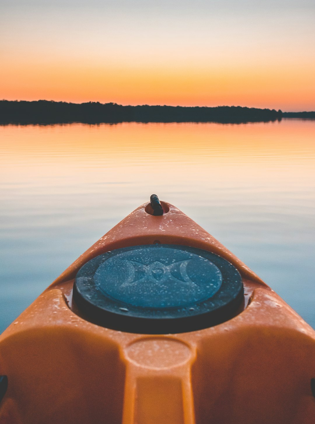 selective focus photography of orange kayak