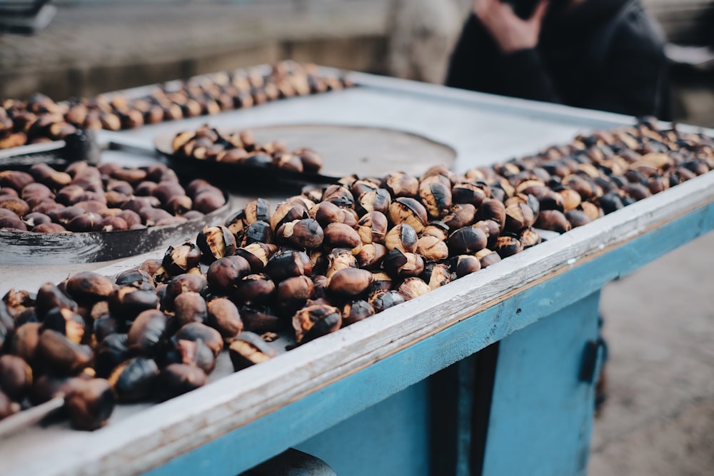 brown and black coffee beans on table