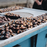 brown and black coffee beans on table