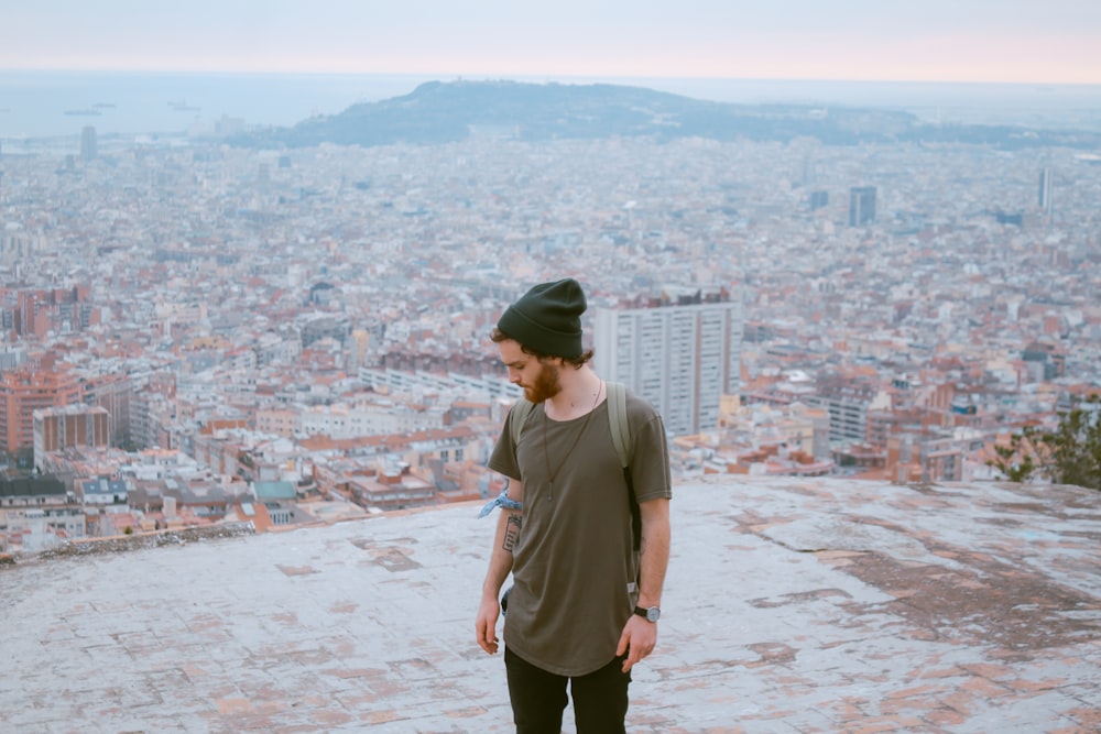 man standing on top of building