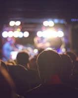 bokeh photography of man wearing shirt