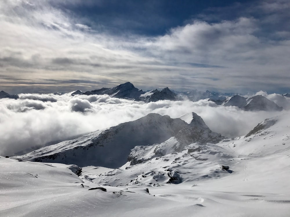 mountain range coated with snow