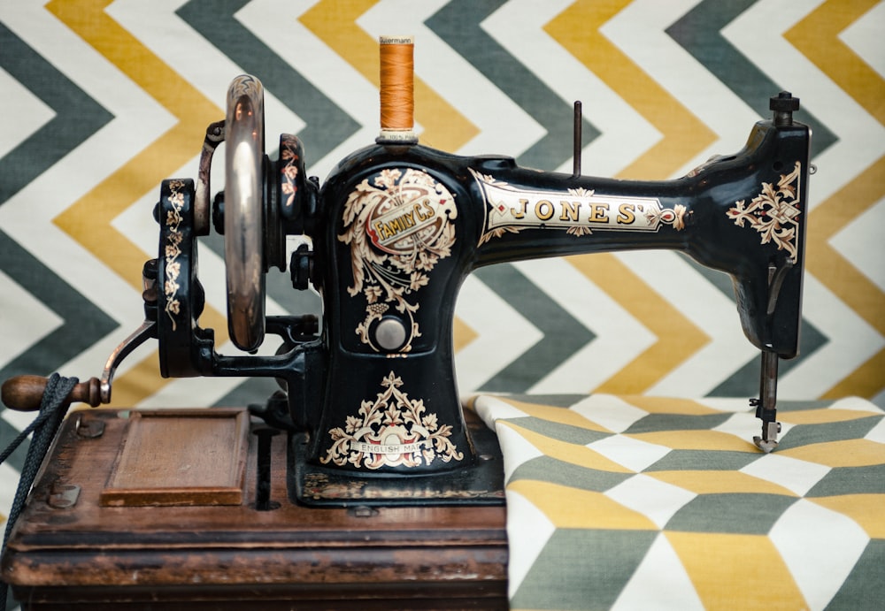 white and yellow chevron cloth on black sewing machine